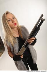 NIKOL STANDING POSE WITH SHOTGUN